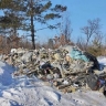 В Свободном строительный мусор выгрузили на кладбище