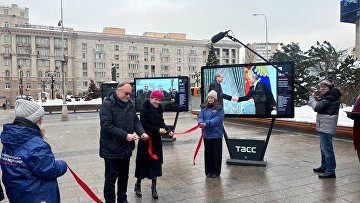 Посвященная 20-летию ОП РФ фотовыставка открылась у здания ТАСС
